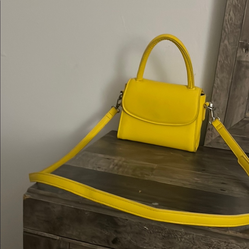Vibrant Yellow Mini Bag with Top Handle and Flap Closure